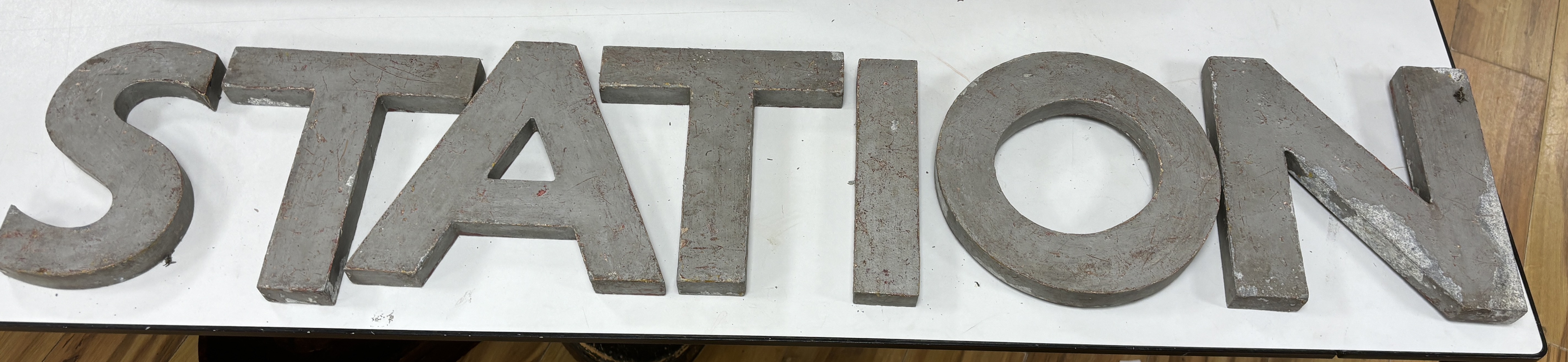 A collection of large metal letters spelling ' Filling Station' letters 23cm high (14)